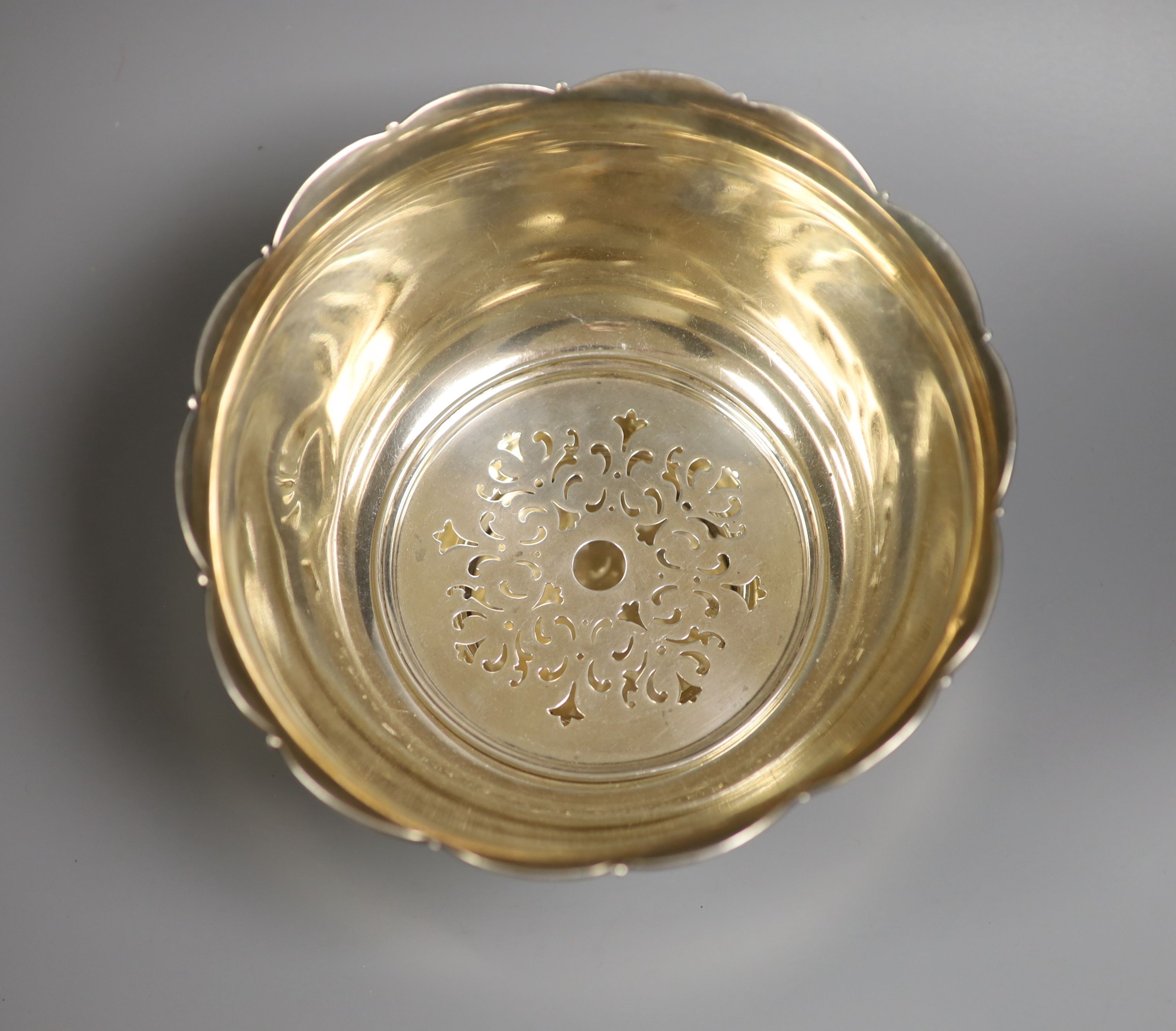 A Tiffany & Co sterling bowl with removable pierced insert(drainer?), diameter 19.5cm, 22.5oz.